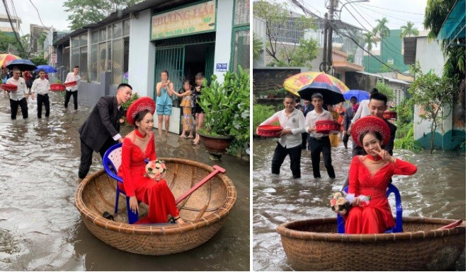 Cô dâu Khánh Vy được chú rể đẩy bằng thuyền thúng, di chuyển qua đoạn đường ngập nước. Ảnh: Nguyễn Kỳ Lu.